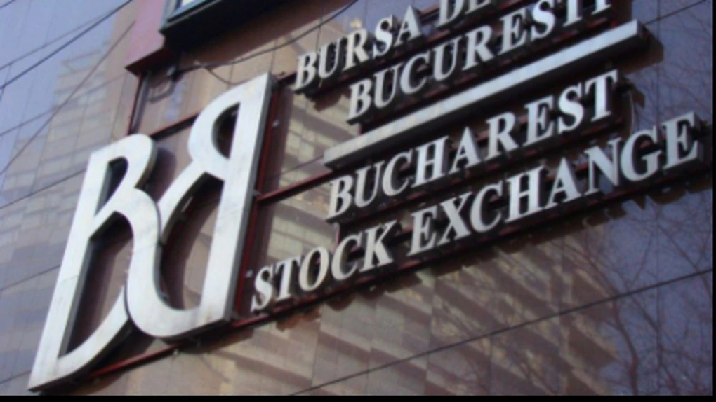 Bursa a scăzut uşor, pe un rulaj salvat din nou de deal-uri