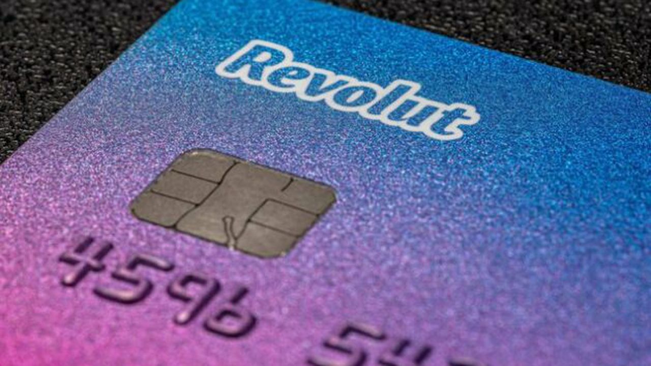 Bonn, Germany June 15, 2020. Payment card belonging to the Revolut electronic bank on a black background, macro shot, mobile banking.