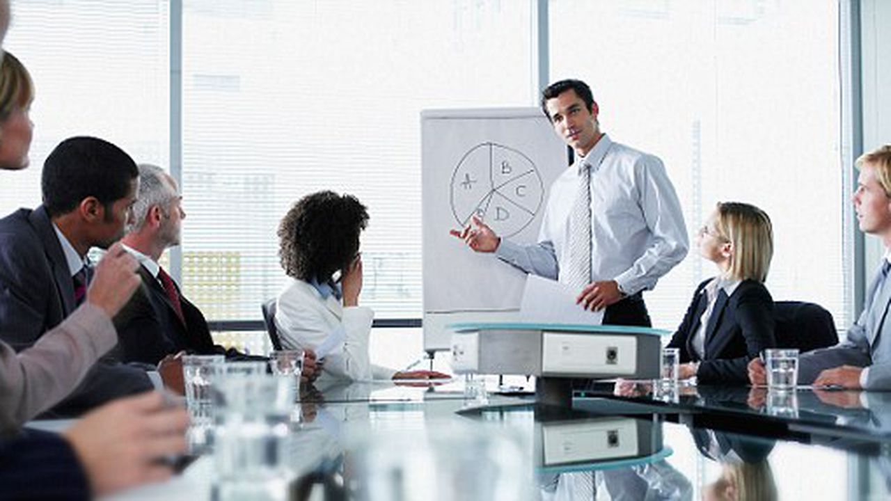 Group of office workers in a boardroom presentation. Image shot 2006. Exact date unknown.