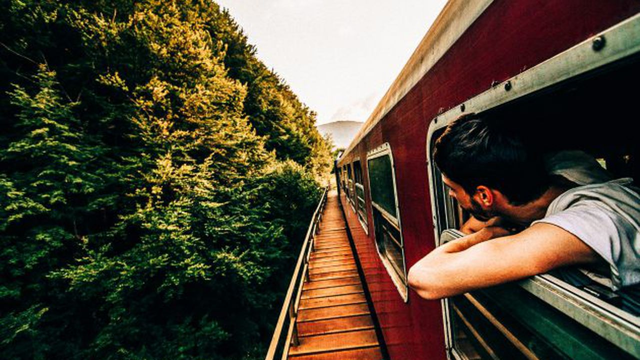 BOY ON RAILROAD TRACKS