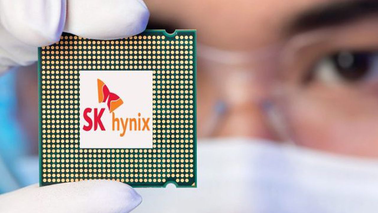 Cropped image of an engineer showing a computer microchip on the foreground