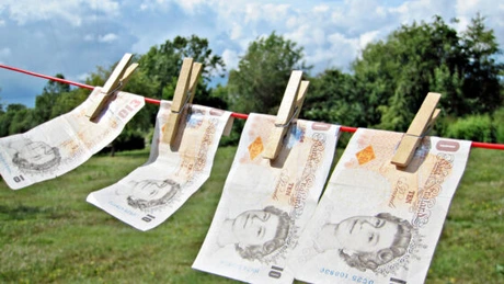 Marea Britanie: Sistemul inadecvat împotriva spălării de bani a lăsat regatul deschis finanţării terorismului - raport