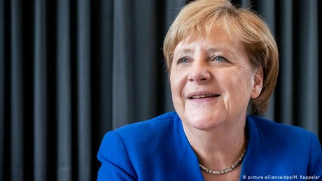Merkel se opune interzicerii depline a Huawei