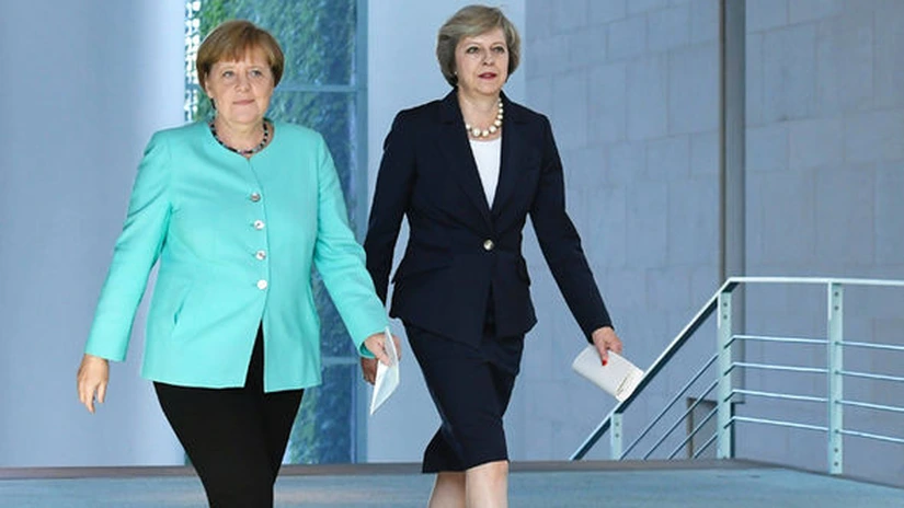 Angela Merkel şi Theresa May continuă disputa privind libertatea de circulaţie a forţei de muncă