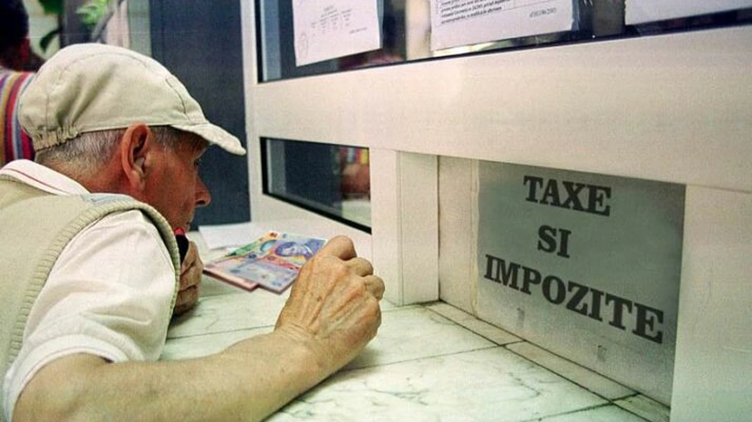 Preşedintele Iohannis solicită reexaminarea unei legi privind impozitul pentru terenurile situate în intravilan